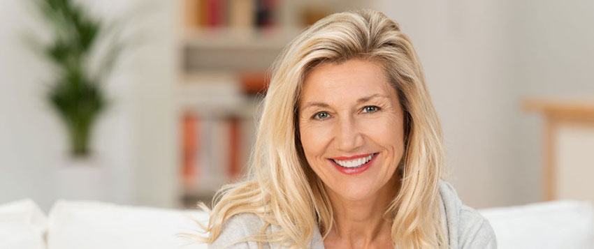 Smiling Woman with Dentures Smiling Woman Sitting