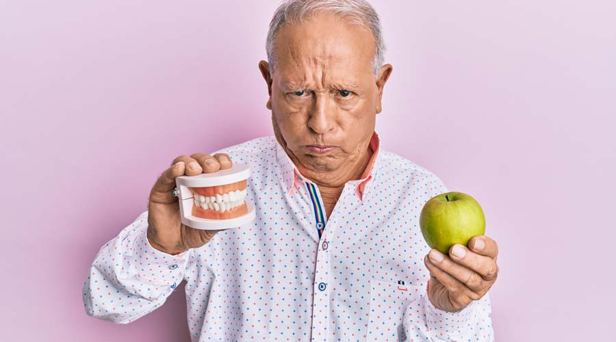 Unhappy Man with Loose Fitting Dentures